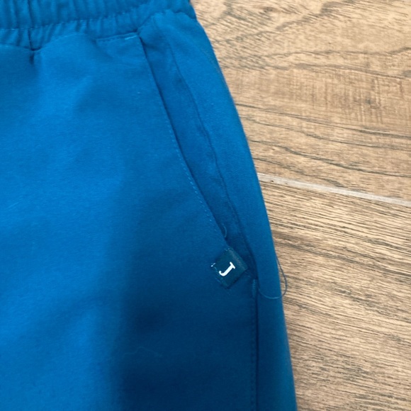 Women’s Jaanuu scrub pants. Color is Caribbean blue and size MP - Picture 2 of 3